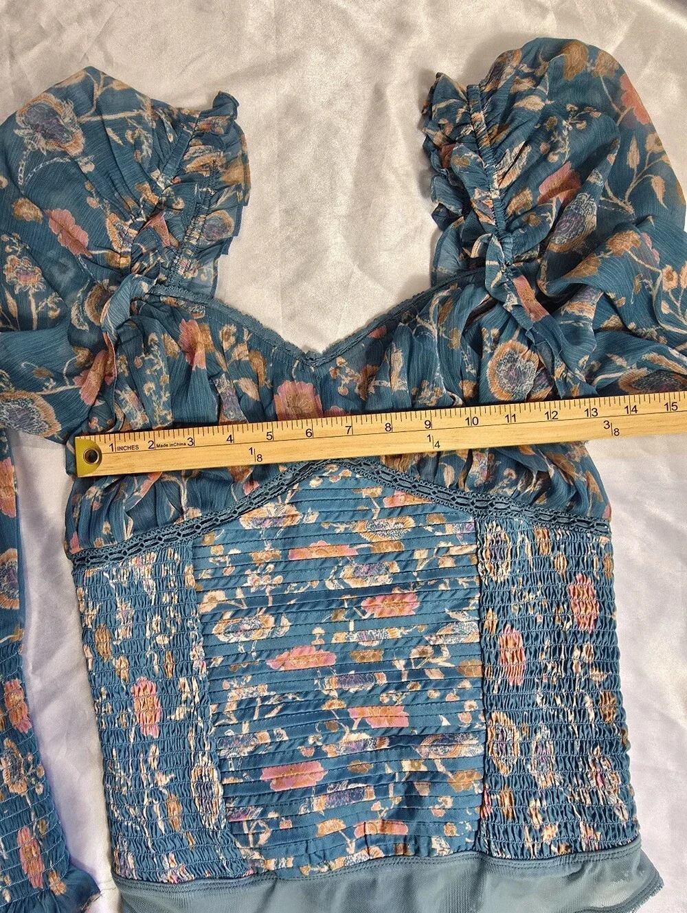Free People Turquoise Floral Smocked  Long Sleeve Bodysuit.